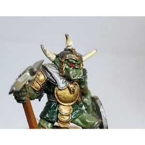 Ogre Warrior With Blue Shield Ax In Fighting Stance On Stone Slab